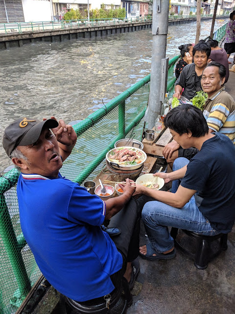 Friendly locals along the canal in Bangkok, Thailand