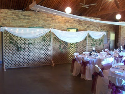 With fabric draping and Ivy around the lattice work