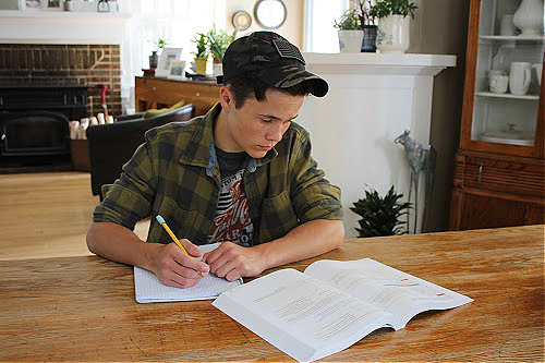 Teen doing homework for homeschool