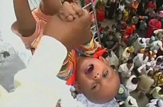 Tossing babies out of the roof for good luck-Maharashtra and Karnataka Tossing babies out of the roof for good luck-Maharashtra and Karnataka