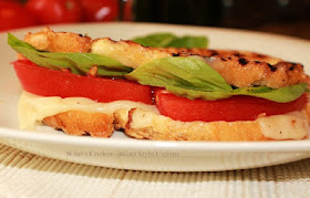 this is how to make a panini without the panini maker. This is a sandwich with tomato, lettuce and delicious melted cheese in it using a cast iron skillet.