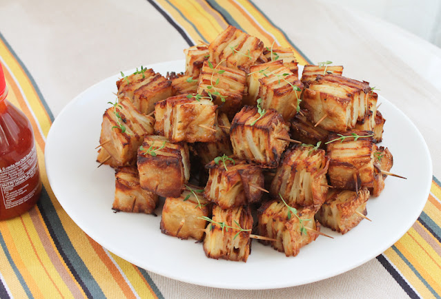 Food Lust People Love:Parmesan Bacon Potato Squares are a tasty appetizer (or side dish) of thinly sliced potatoes layered with bacon, cream and cheese that turn crispy and more-ish when they are baked, cooled then cut into squares and roasted in the oven.