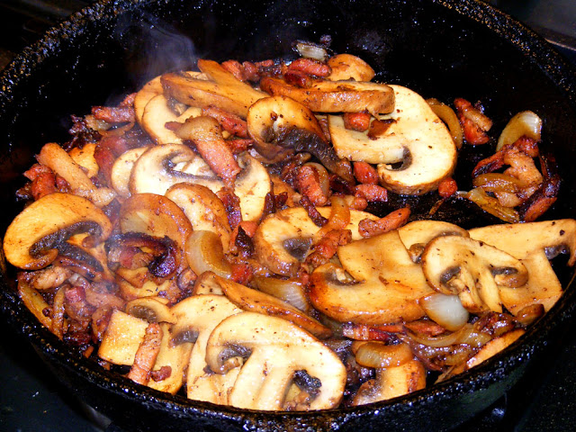 Frying cave grown mushrooms with lardons and onions.  Indre et Loire, France. Photographed by Susan Walter. Tour the Loire Valley with a classic car and a private guide.