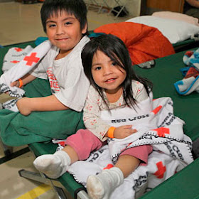 children wrapped in blankets