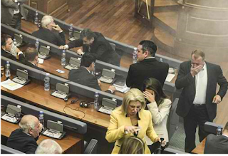Kosovo opposition lawmakers hurl tear gas in parliament: Video