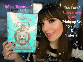 Ultima Beauty holding Too Faced's Unbearably Glam Makeup Set Box. Text reads: "Ultima Beauty presents Too Faced Unbearably Glam Makeup Set Review & Tutorial