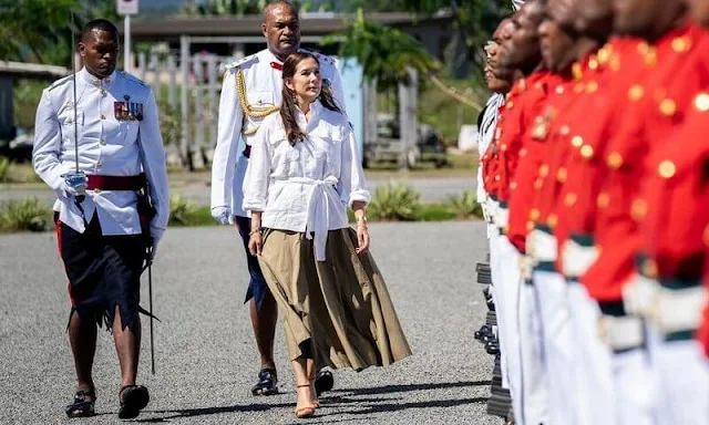 Princess Mary wore a white belted linen shirt by Ralph Lauren, and a Terrana green skirt from By Malene Birger