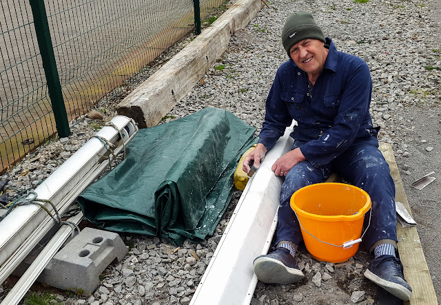 Photo of Phil sanding his repair to one of the exhaust manifolds