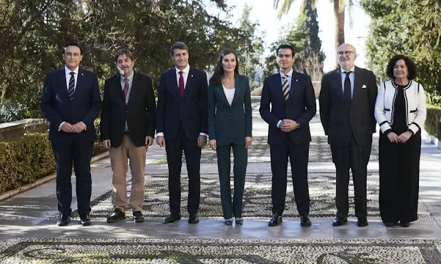 Queen Letizia wore a wool blend longline blazer suit by Carolina Herrera, during the meeting at the old Royal Hospital of Granada