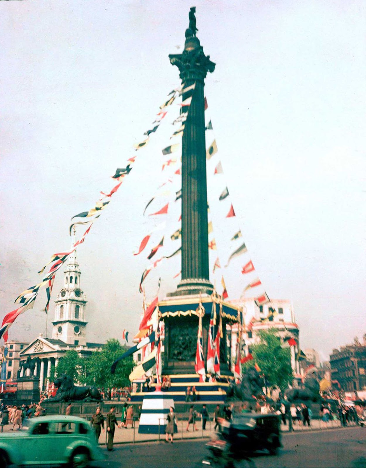 Nelson's Column festooned with flags to celebrate VE Day. Sept. 3, 1945.