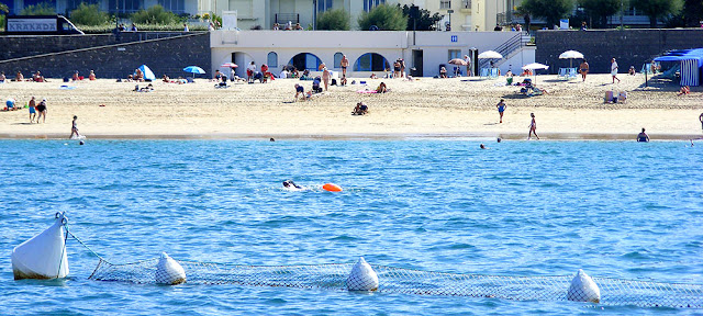 Swimming across the bay at Saint Jean de Luz. Pyrenees-Atlantiques. France. Photographed by Susan Walter. Tour the Loire Valley with a classic car and a private guide.