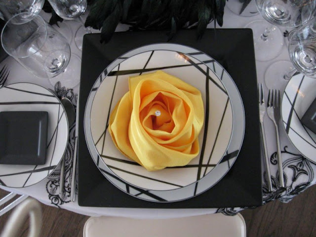 stunning-wedding-napkins-fold-yellow-rosette-and-crystal-in-the-center