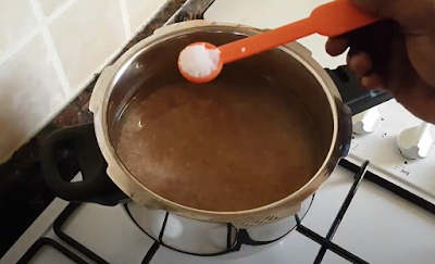 Red rice cooking in pressure cooker