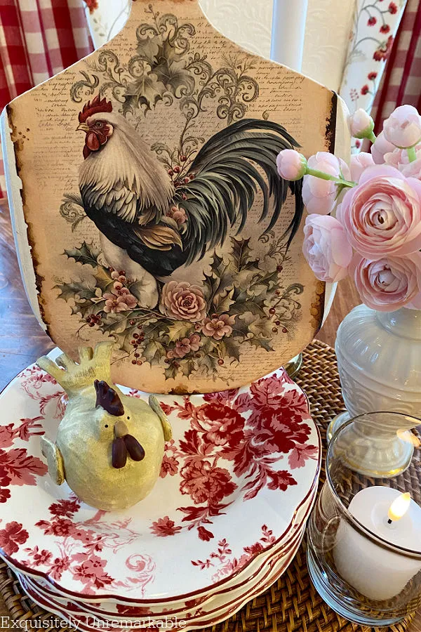 Rooster Pattern Cutting Board Makeover on a table with roses and floral dishes