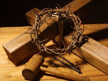 Wooden cross,hammer and crown of thorns with nails at the crucifixion 