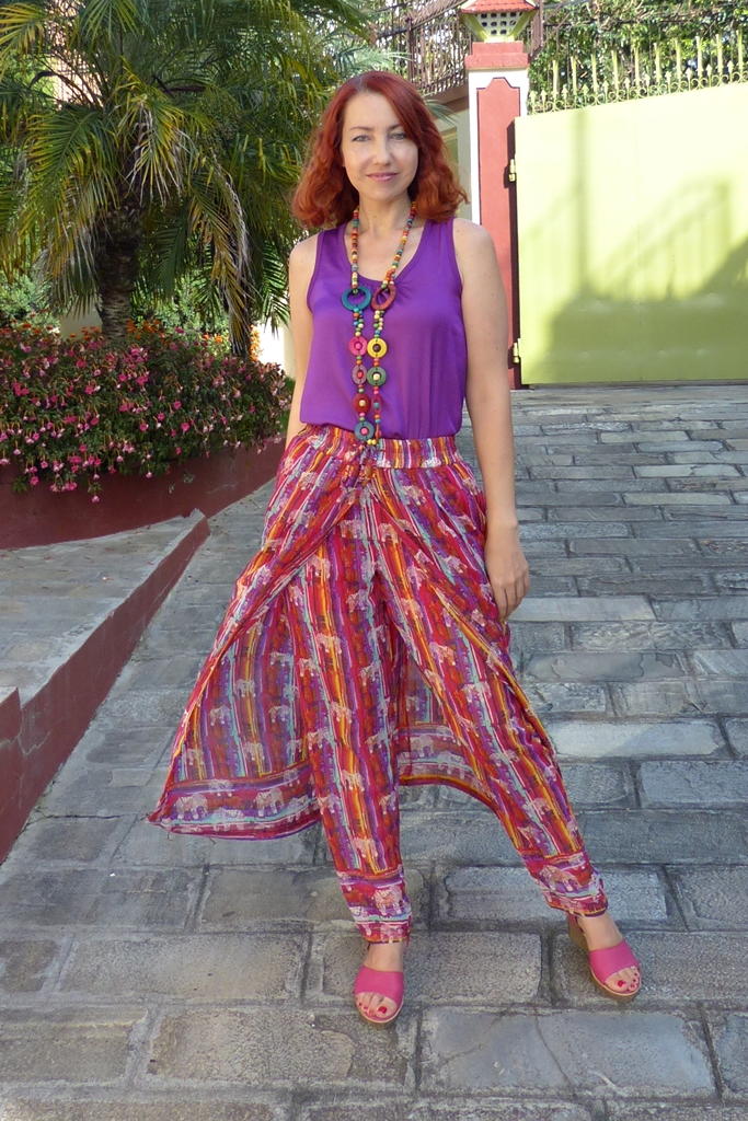 Global Desi gypsy palazzo pants worn with purple top and wooden necklace