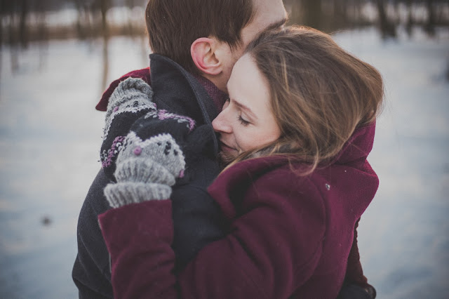 Man and Woman hugging each other.