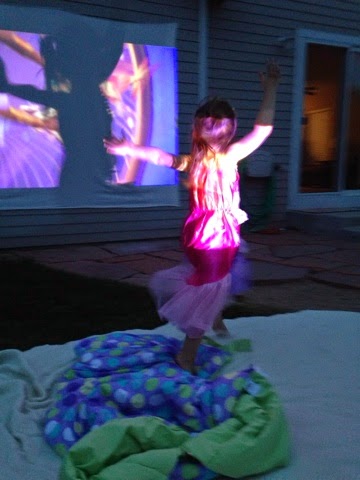 Summer movie night in the back yard! Fun for kids and romantic for date nights! Easy set up projectors are on sale everywhere for the summer! www.thebrighterwriter.blogspot.com