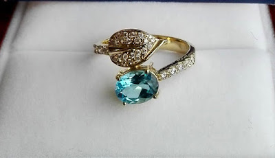 blue topaz set in engagement ring