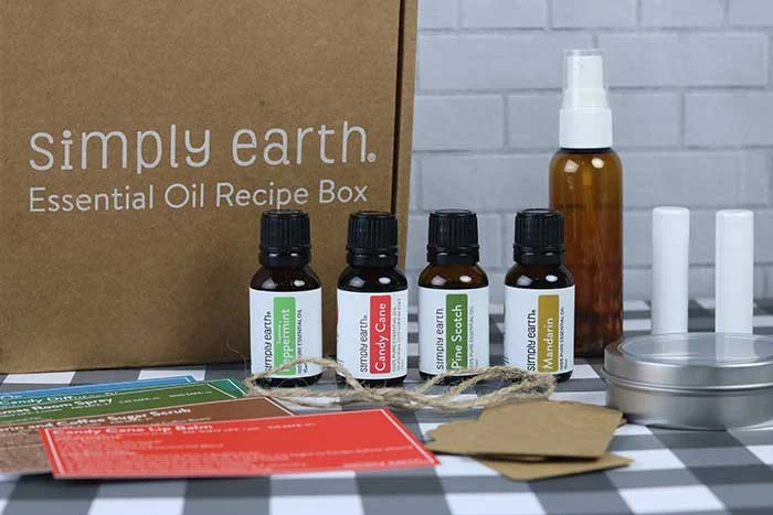   How to make 6 easy essenital oil gifts at home. These are great Christmas ideas for teachers, for friends, or even for Mother's Day or another holiday. Learn how to make a lip balm, roller blend, air freshener, coffee sugar scrub, and more products. Combine them for a simple basket set.  DIY homemade gifts are easy to make these with these recipes. #essentialoils #diy #gift #diygift