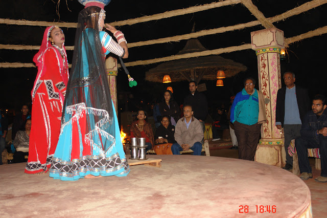 Photo of 2 dancers Getting ready to take the dance to a higher level in the cultural tourist village of Chokhi Daani
