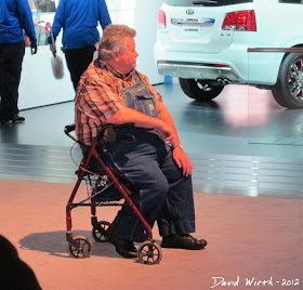 Fat Guy in Overalls at the Auto Show