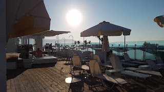 Clothes & Dreams: 48 hours in Crete, Heraklion. Capsis Astoria Hotel roof pool bar.