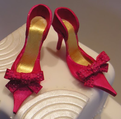 The bride wore white and a pair of fabulous red shoes The cake artists at 