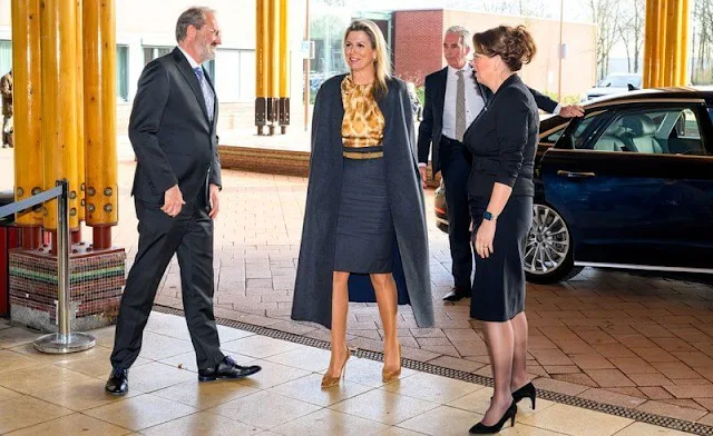 Queen Maxima wore a mustard yellow leopard print silk blouse by Natan, and dark gray skirt by Natan. Valentino dark gray cape