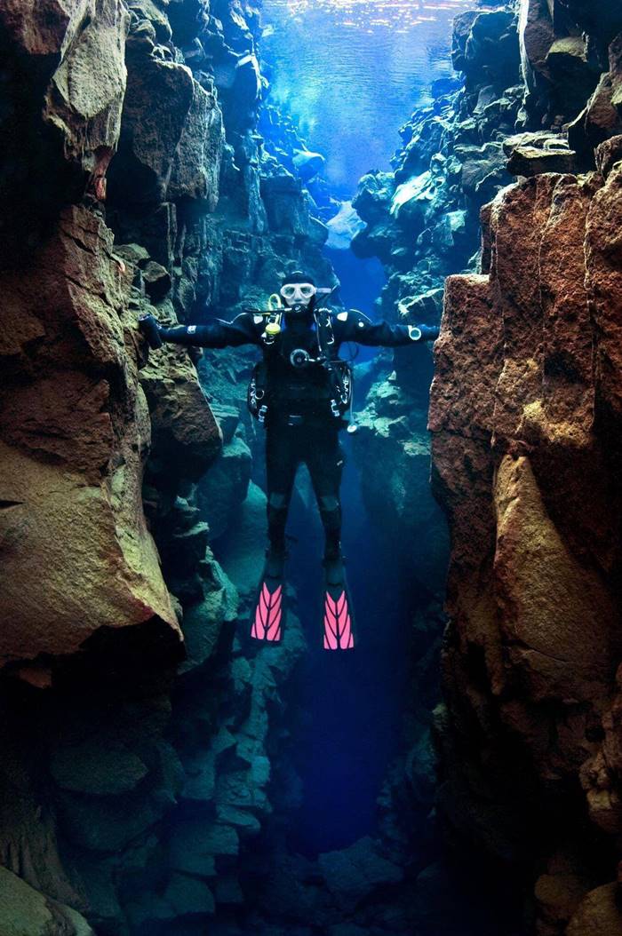 The space between North America and Europe, this diver is touching both continent.