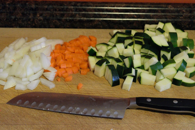 The onion, garlic, carrot, and zucchini chopped and ready to be added to the pot. 