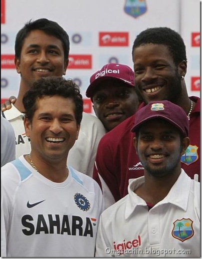 India's Sachin Tendulkar (bottom L), Pragyan Ojha (top L), West Indies' Adrian Barath (bottom R), Kirk Edwards (top R) and Fidel Edwards pose for a group picture during the presentation ceremony after the