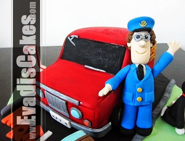 View of Postman Pat and his red car cake