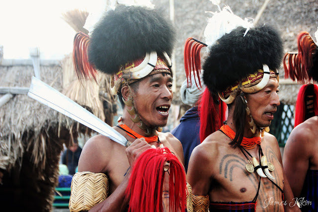 Khiamniungan Naga tribesmen perform traditional folk song and dance