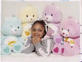 Amya posing with the care bears