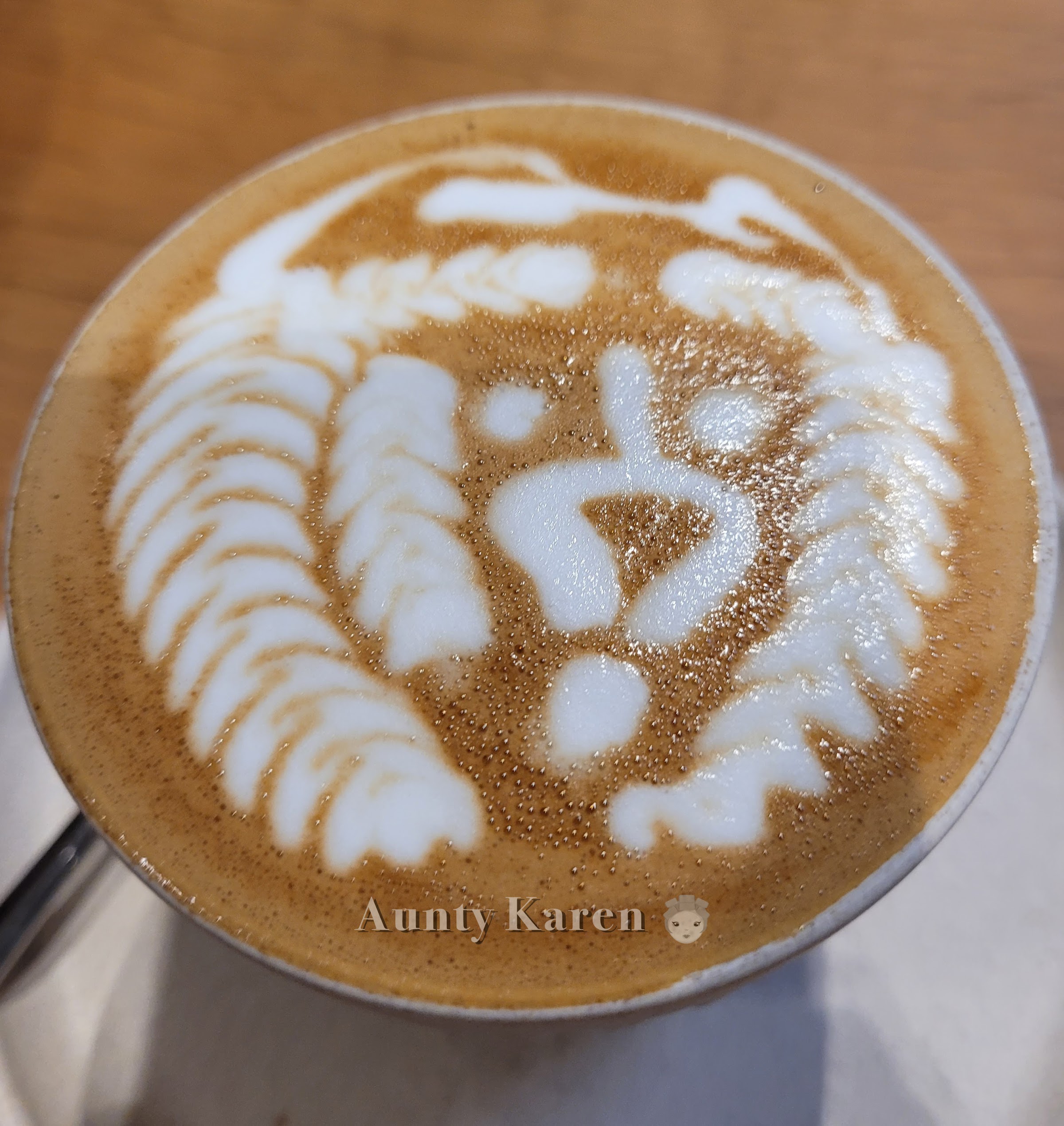 Close-up of a latte with coffee art of a lion