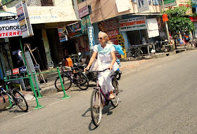 white woman on cycle in Puducherry