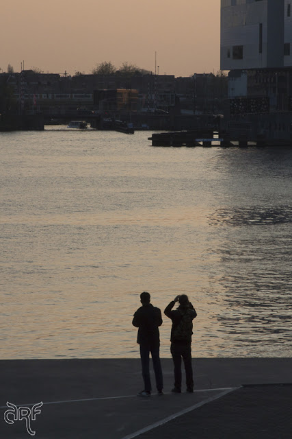 two people enjoying the sunset