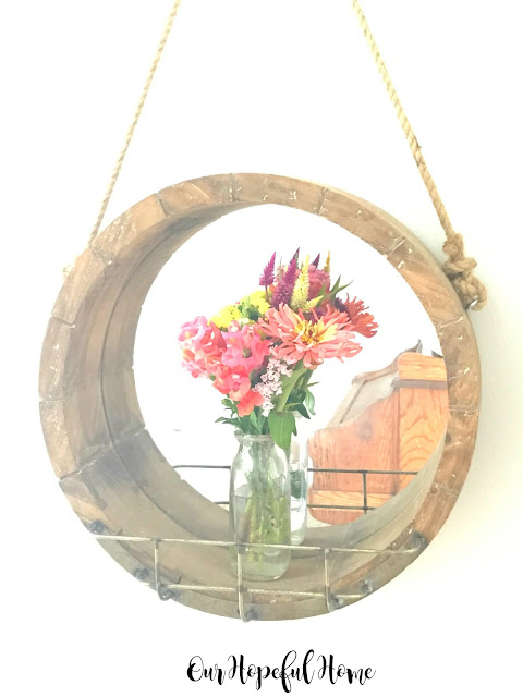 round wooden farmhouse mirror vintage milk bottle vase fresh cut flowers