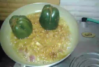 Put stuffed capsicum in pan