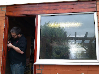 Vincent fitting the latch to the new door frame