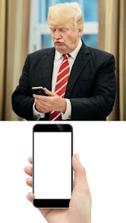 TRUMP LOOKING AT PHONE