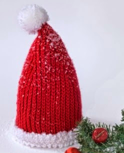 http://www.yarnspirations.com/patterns/baby-santa-hat.html