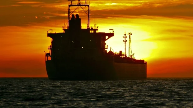 Image Attribute: An oil tanker is anchored near the Port of Long Beach, California, U.S.A /Source: Tim Rue/Bloomberg