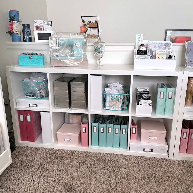 IKEA Kallax Shelves, Container Store blush boxes and aqua baskets, Tim Holtz tins, Scrapbook.com albums