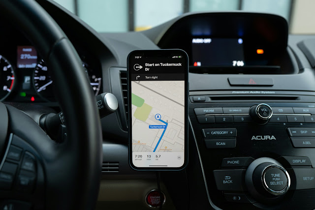 phone in car displaying GPS map:Photo by Ravi Palwe on Unsplash