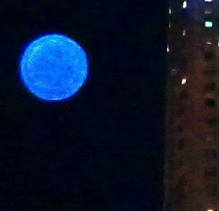 blue orb in sky