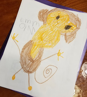 A crayon drawing of a monkey by Emma McAndrews, age 5.