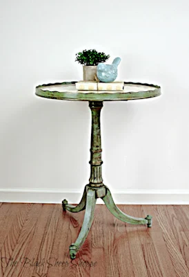 Pedestal side table repaired and painted.