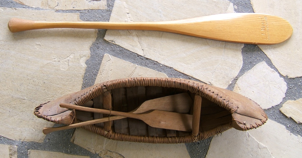  canoe paddle and the birch bark canoe model make delightful decorator
